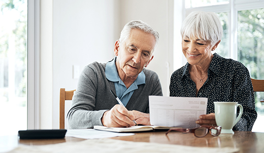 Couple reviewing Medicare paperwork