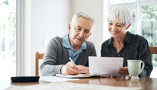 Couple reviewing Medicare paperwork