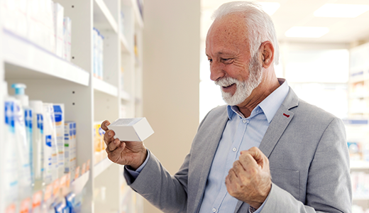 Older man getting over the counter medicine