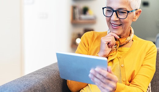 woman looking at her tablet